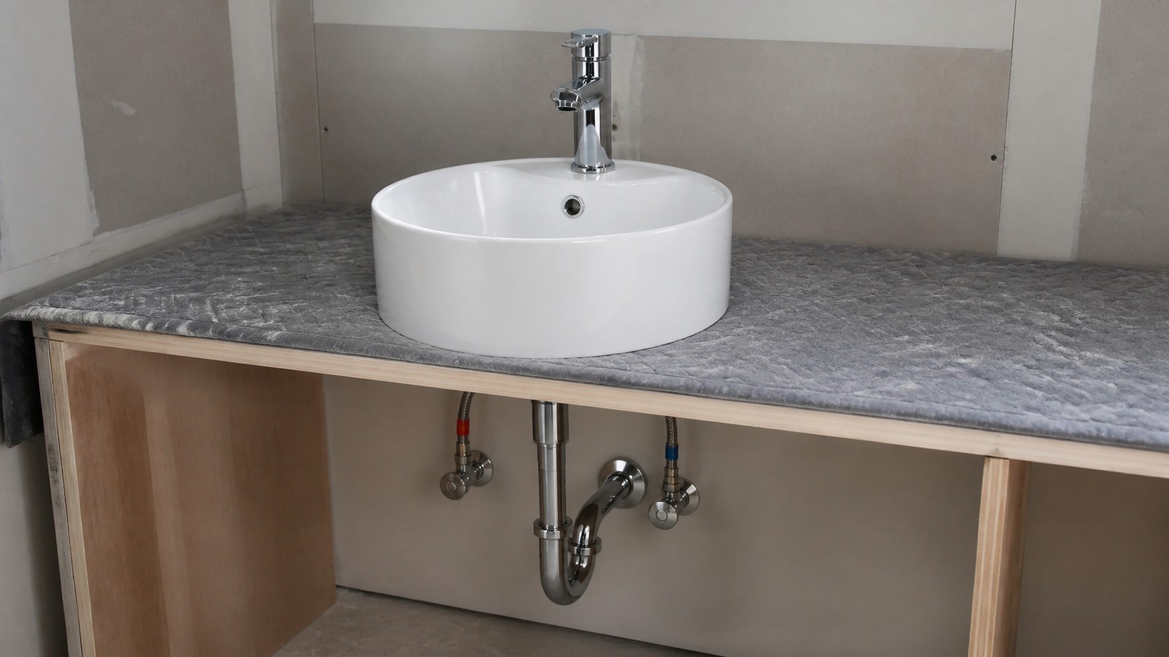 Round vessel sink with basin-mounted faucet coordinated with supply valves and drain rough-in