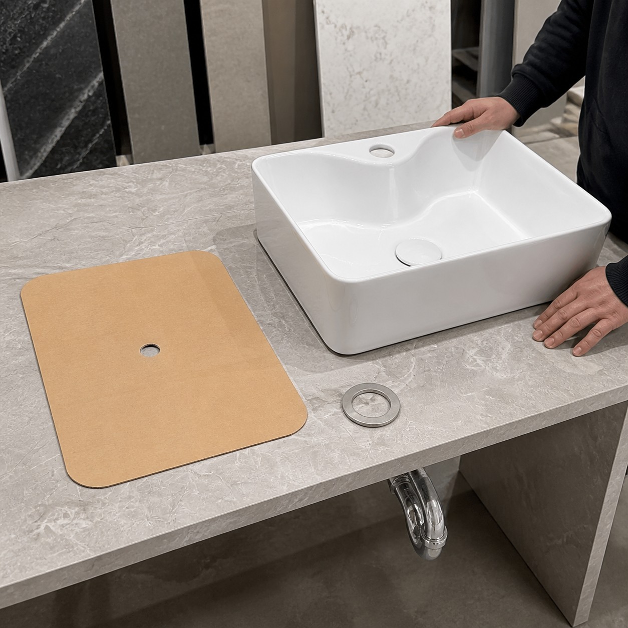 Countertop fabricator checking a bathroom sink template rim reveal and support