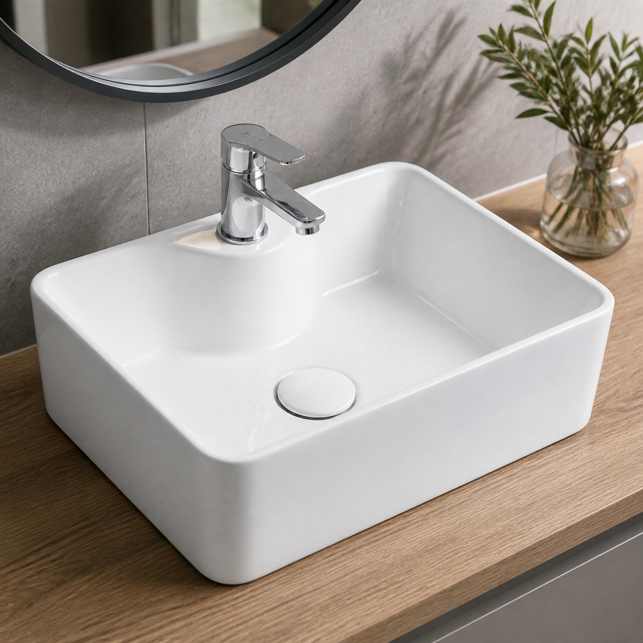 Light limescale ring and water spots around the drain of a glazed ceramic sink