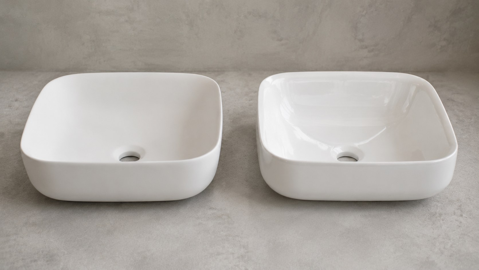 Ceramic and porcelain wash basins on a factory display shelf showing glaze and finish differences
