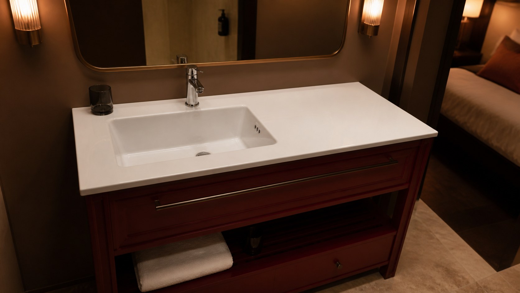 Left-offset ceramic vanity basin in a boutique hotel sample bathroom