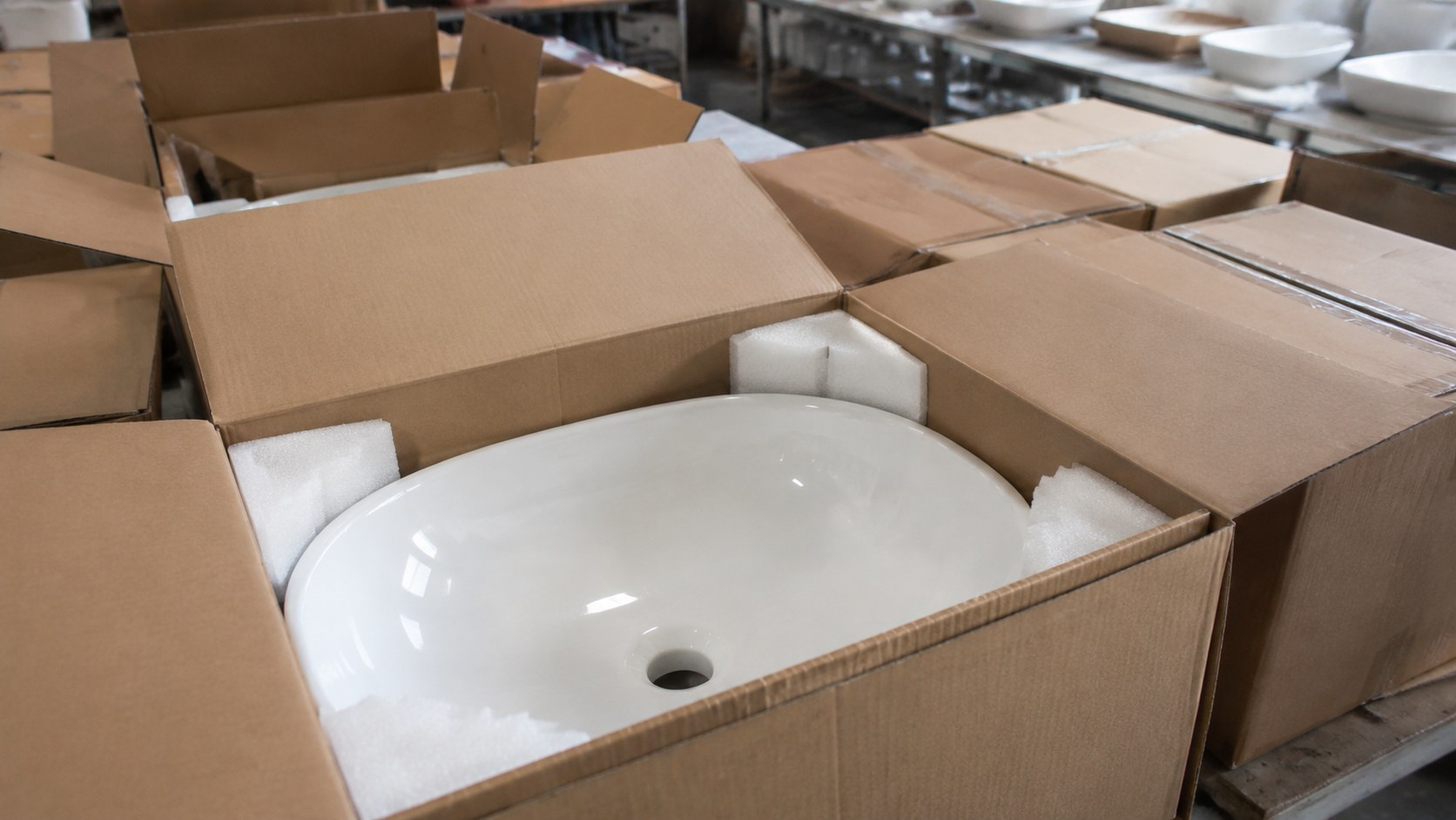 Porcelain wash basins in protective foam and reinforced export cartons ready for container shipping