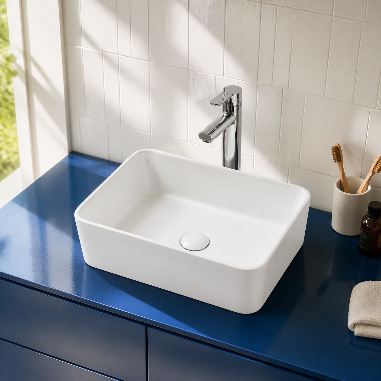 Round ceramic art basin with a deck-mounted faucet in a cobalt powder room