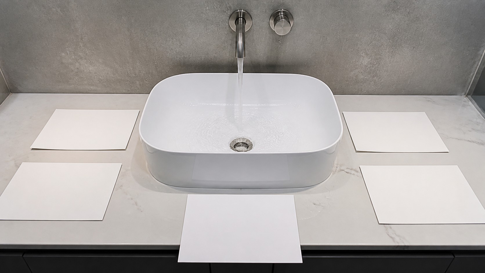 Absorbent cards documenting vessel sink splash test